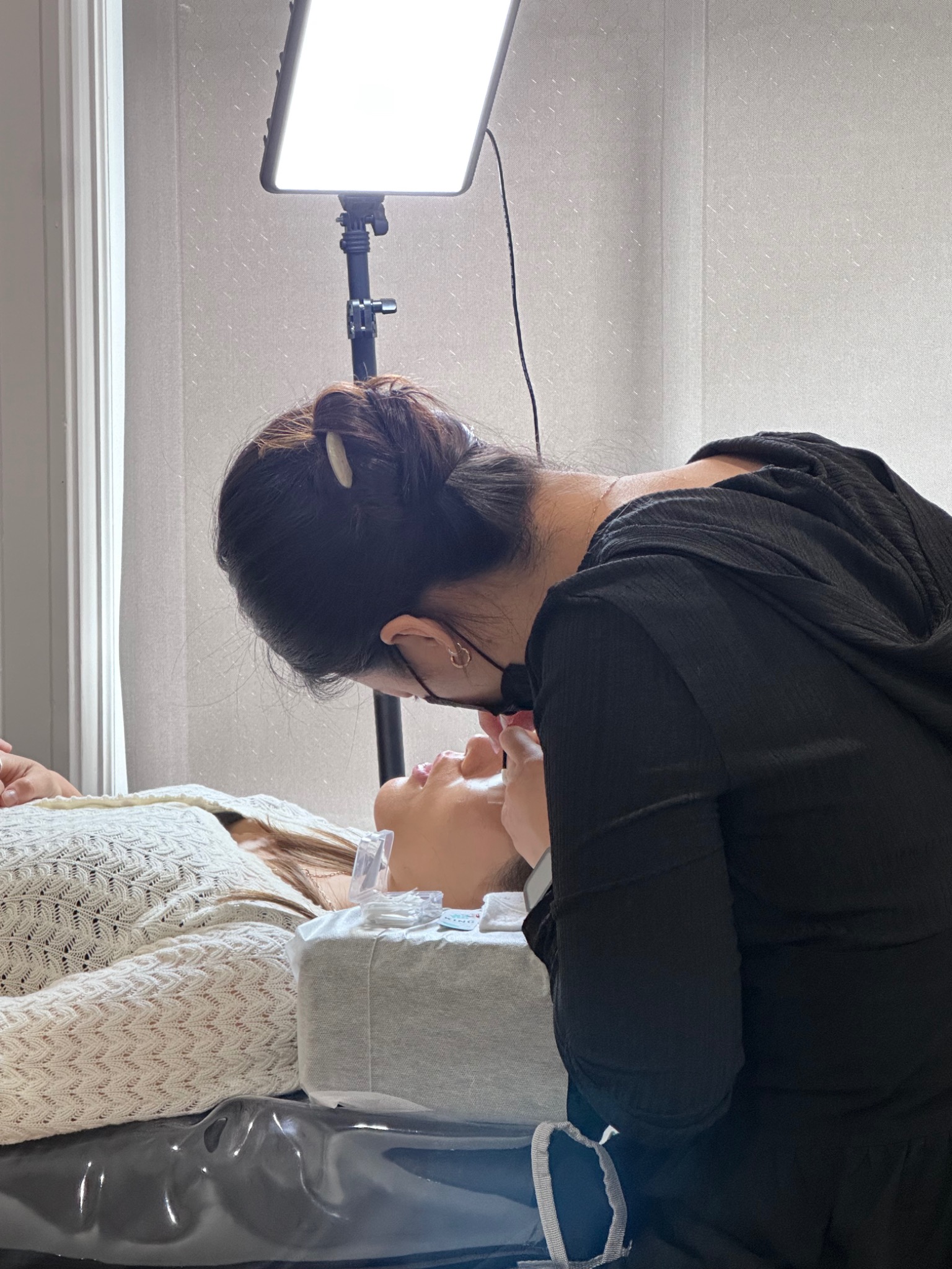 Hands-on lash lift practice on a live model